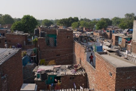 A boy on one of the many layered rooftops.