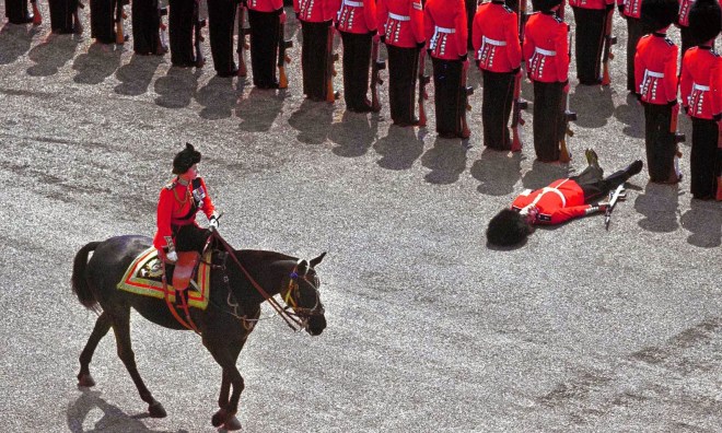 A guard of honor passes out as Queen Elizabeth II rides past during the trooping the color parade, 1970